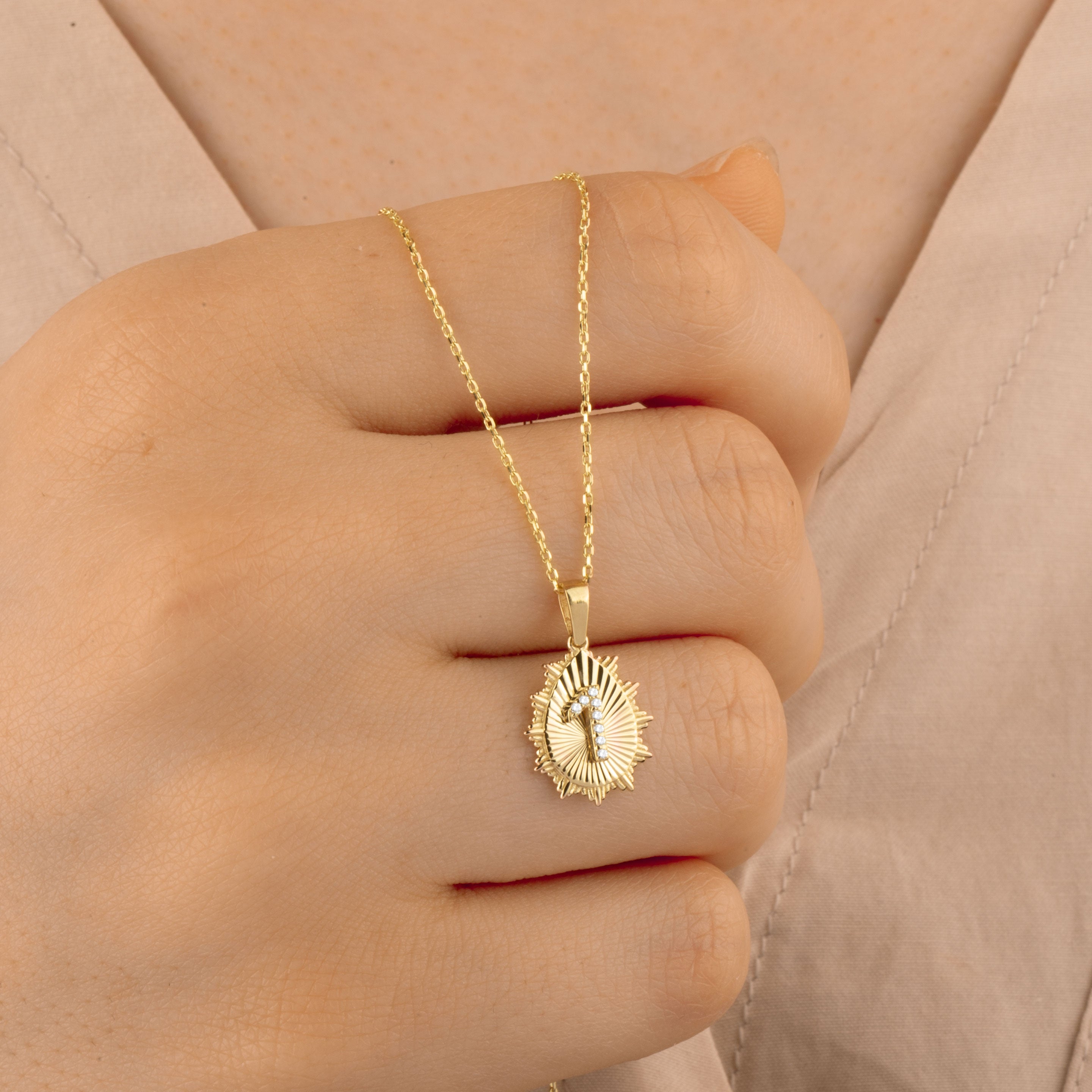 Elegant 14K gold necklace with a diamond-studded &quot;1&quot; initial pendant. A modern and sophisticated customizable jewelry piece, available with a gold chain for a complete look.