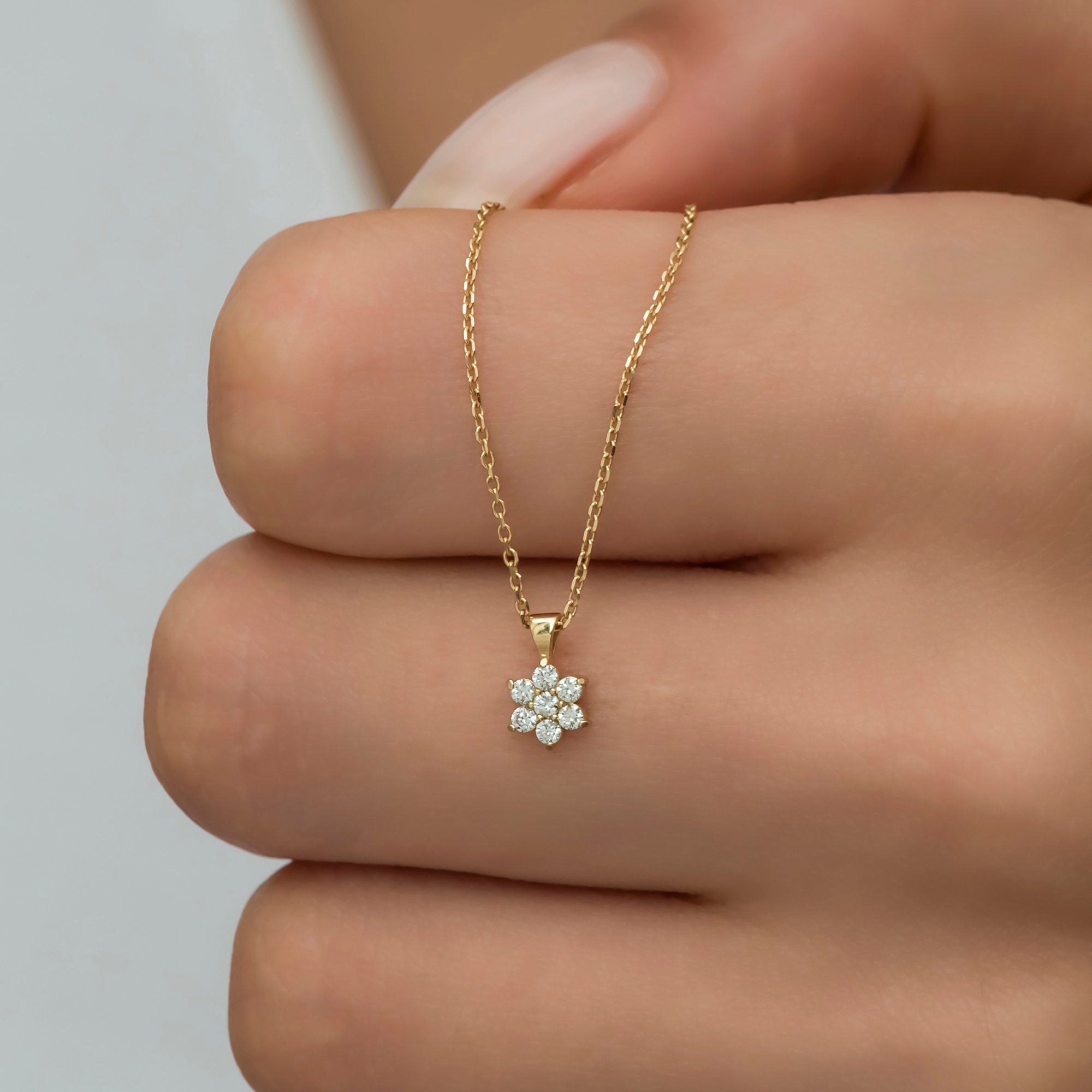 Dainty 14K gold necklace with a shimmering diamond flower pendant. A perfect blend of elegance and charm, ideal for gifting on Christmas, Valentine’s Day, Mother’s Day, or any special occasion for the one you cherish.