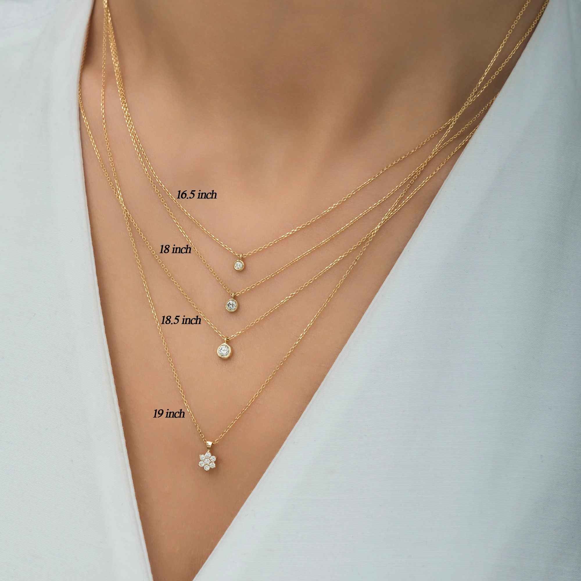 Elegant 14K gold necklace featuring a 5.50mm diamond-encrusted flower pendant, shown in 16.5, 18.5, and 19 inches; chain lengths. Note: Pendant design may vary in the example images. A delicate and timeless gift, perfect for special occasions.