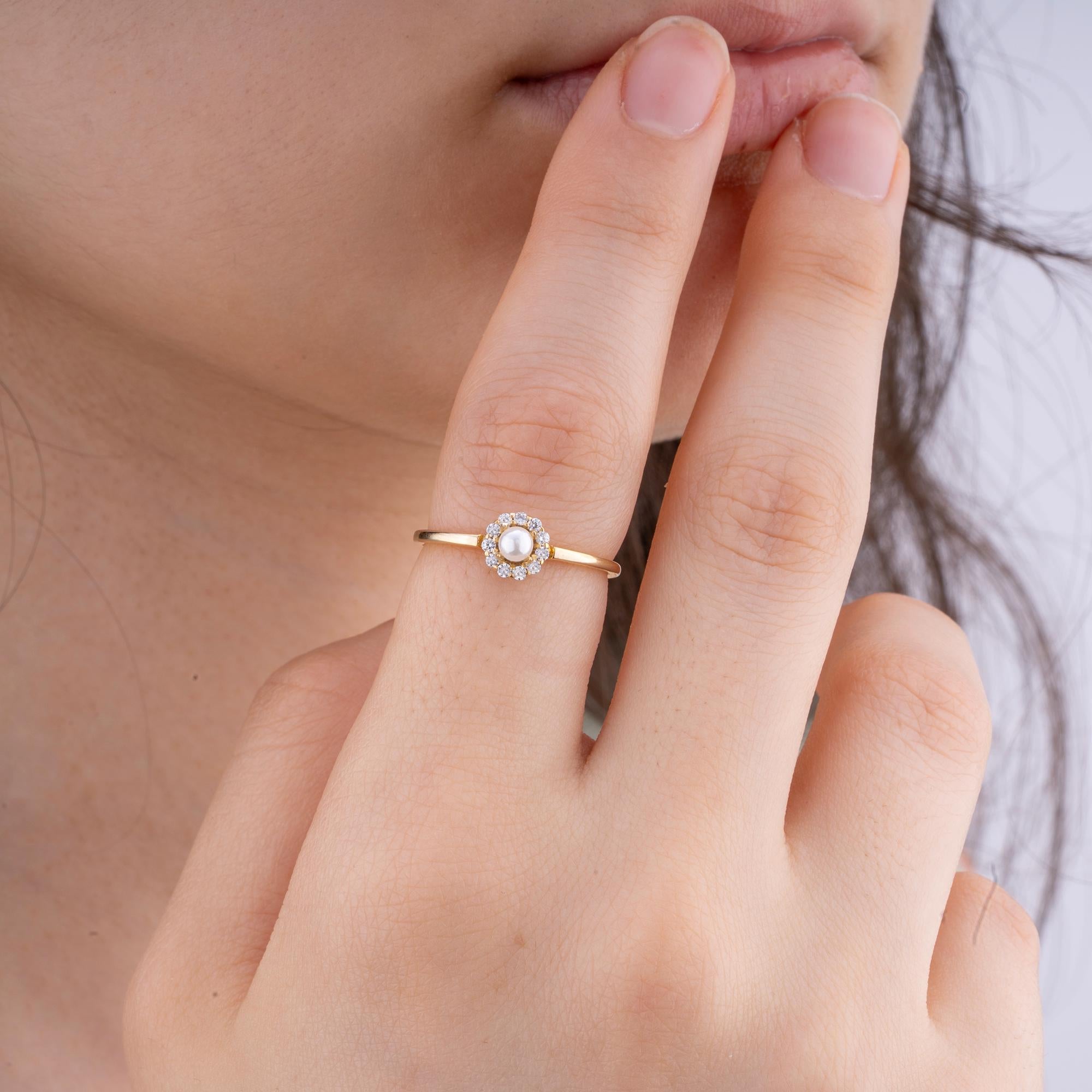 Timeless 14K Gold Ring with Pearl and Diamonds - A delicate 1.55 gr ring design featuring a radiant pearl and 11 round diamonds, ideal for meaningful birthday gifts or special celebrations.