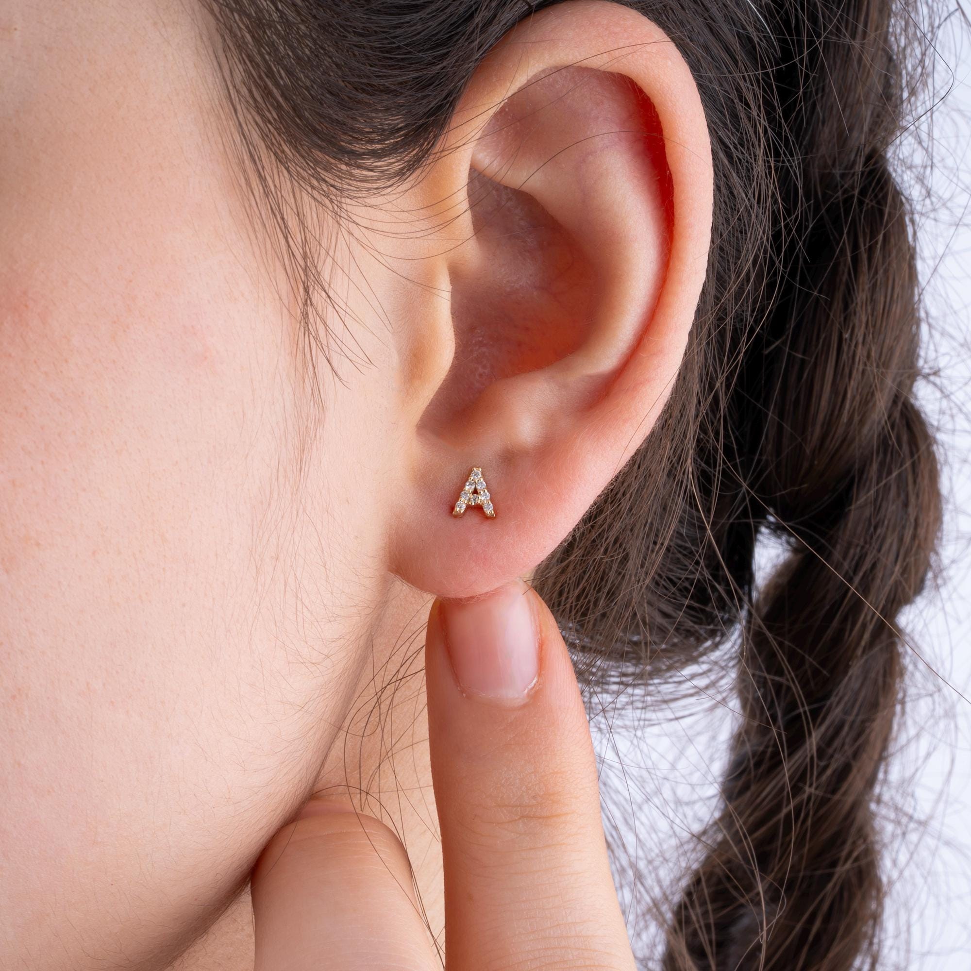 Elegant 14K Gold Diamond Initial Stud Earrings with sparkling diamonds in a pave setting, customizable with your preferred letter.